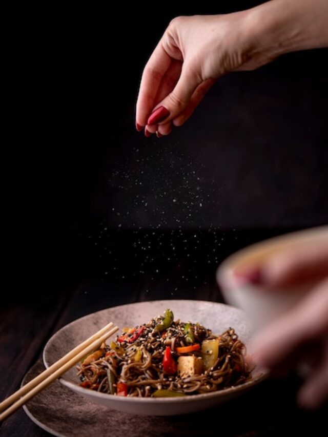 hand-sprinkling-salt-bowl-noodles-with-vegetables_23-2148382865 (1)